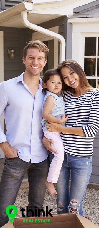 Couple standing with new home