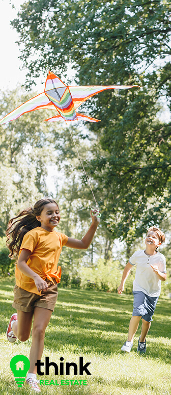 Happy Kids Flying a Kite